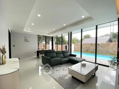 Luxurious modern living room with pool view and sleek interior design
