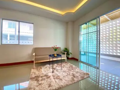 Bright living room with modern decor and large windows for natural light