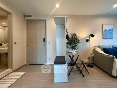 Modern living room with stylish decor and cozy seating area, perfect for relaxation and entertaining.
