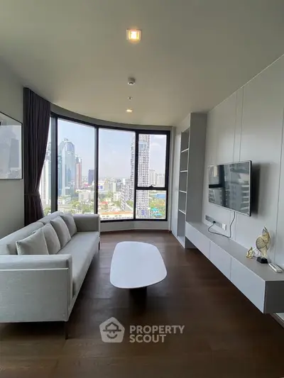 Modern living room with panoramic city view, sleek furniture, and large windows.