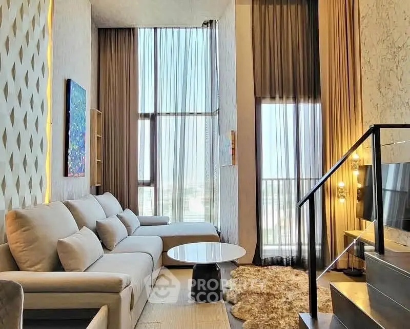 Luxurious high-ceiling living room with modern decor and large windows offering stunning city views.