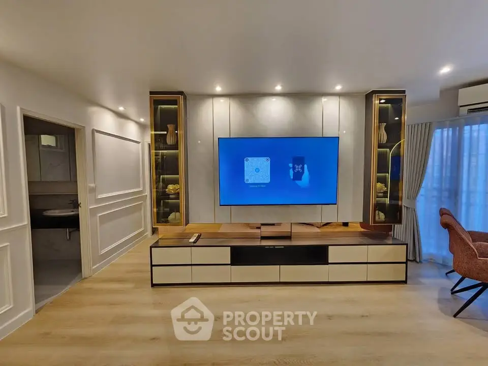 Modern living room with sleek TV setup and elegant lighting