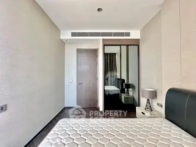 Modern bedroom with minimalist design and sleek furniture