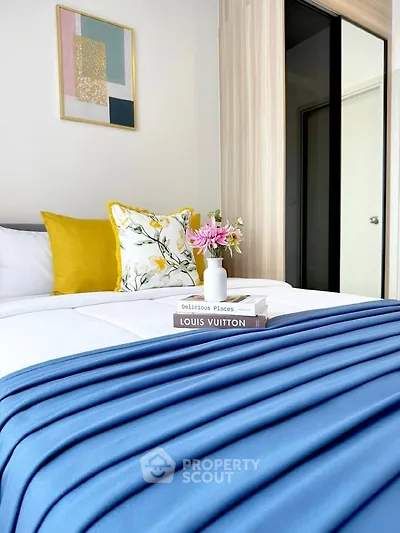 Stylish bedroom with modern decor and vibrant accents, perfect for a cozy and inviting atmosphere.