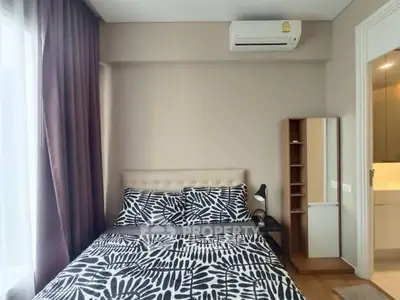 Modern bedroom with stylish decor and air conditioning unit