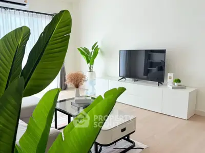 Modern living room with sleek TV setup and lush indoor plants