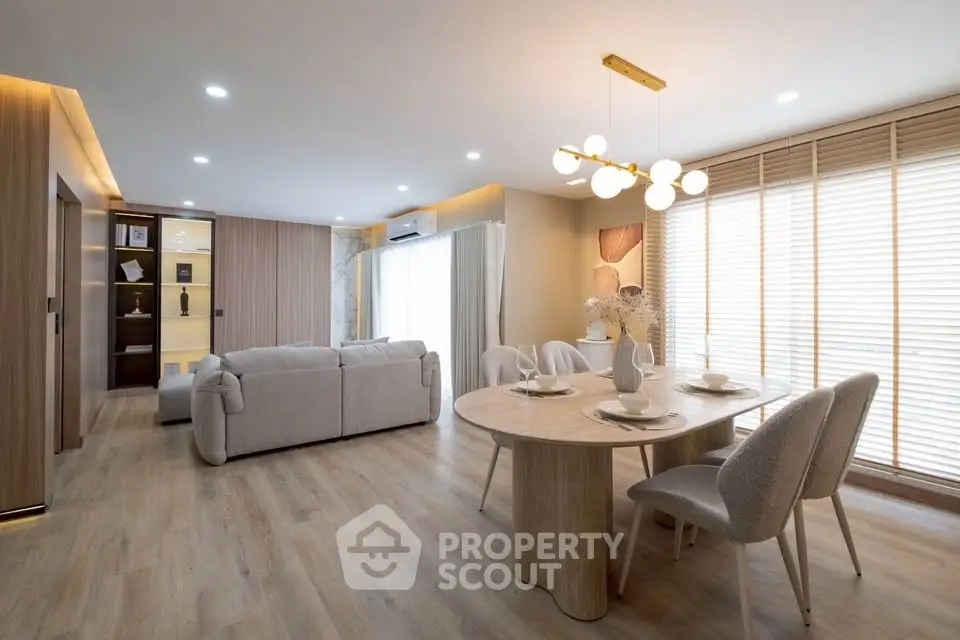 Spacious modern living room with elegant dining area and natural light