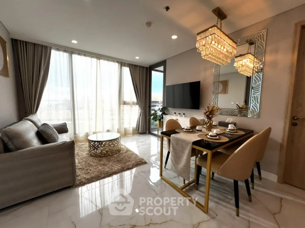 Luxurious modern living room with elegant dining area and stunning chandelier