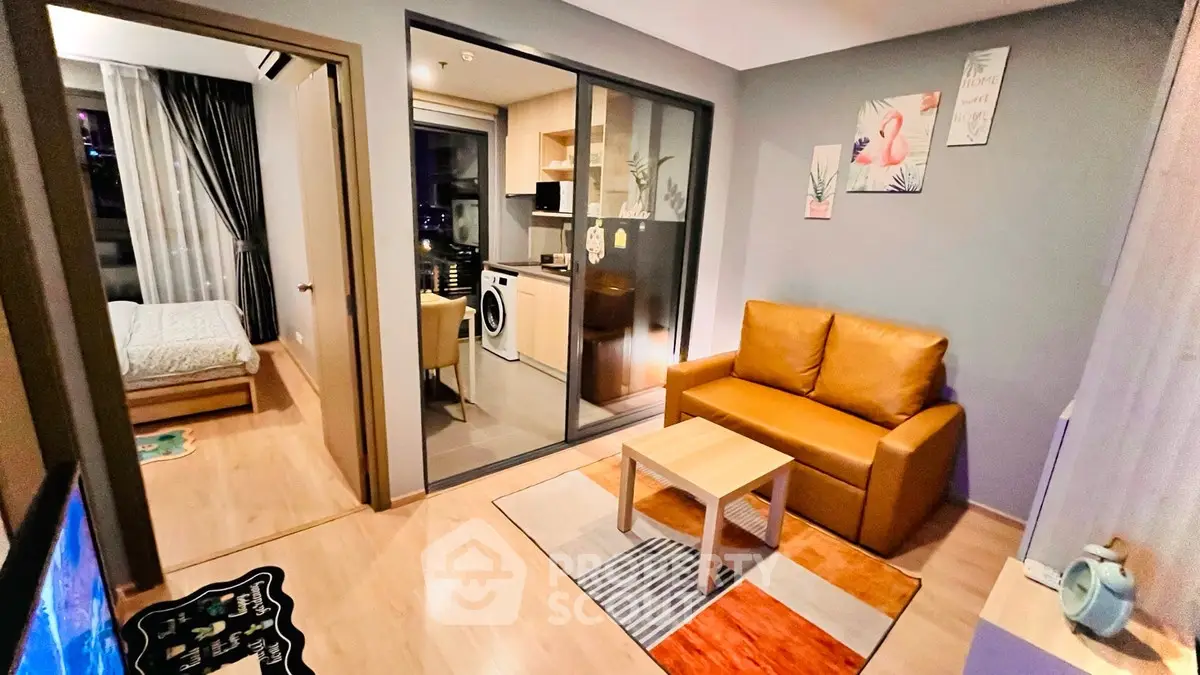 Modern apartment interior with cozy living room and compact kitchen