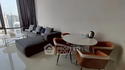 Modern living room with city view, stylish furniture, and natural light.
