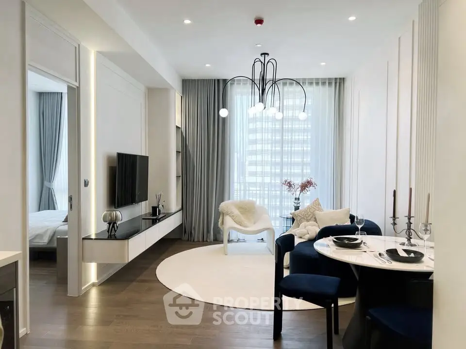 Modern living room with elegant decor and dining area in luxury apartment