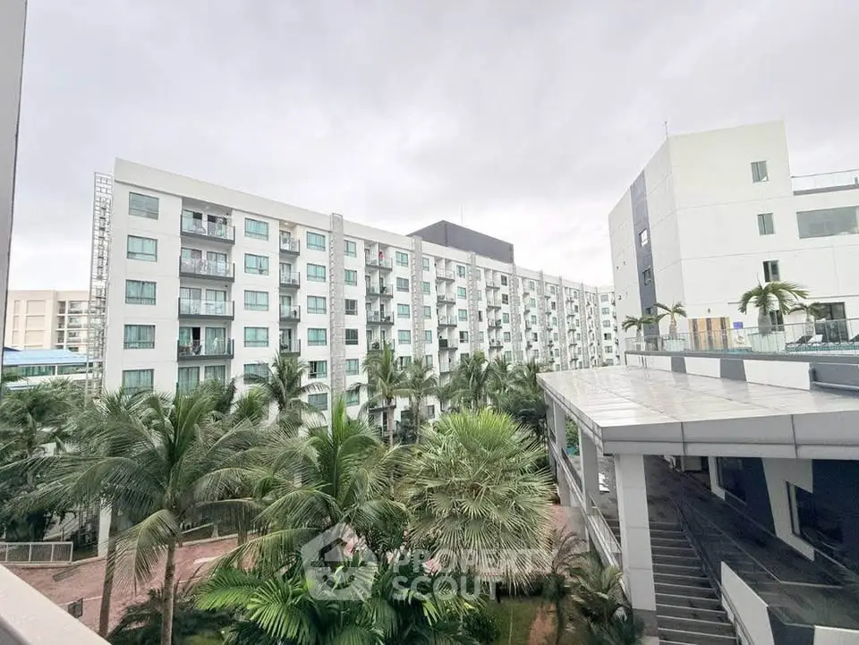 Modern residential building with lush greenery and spacious balconies