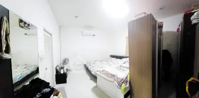 Spacious bedroom with modern decor and ample storage space