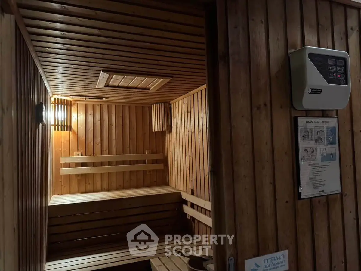 Luxurious wooden sauna room with ambient lighting in a modern building