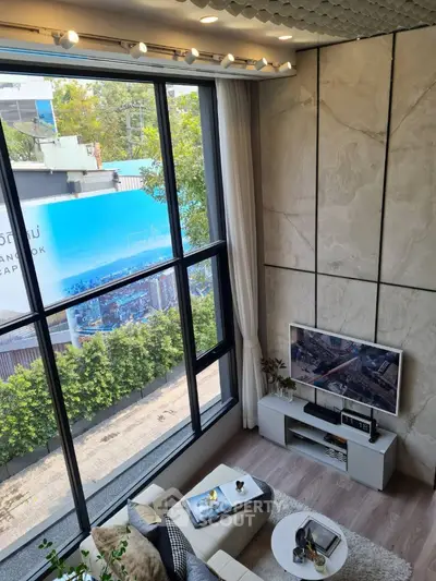 Modern living room with large windows and stylish decor in urban setting