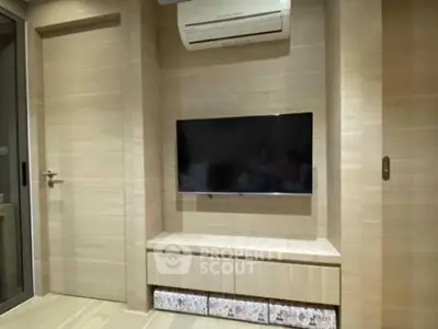 Modern living room with wall-mounted TV and air conditioning unit