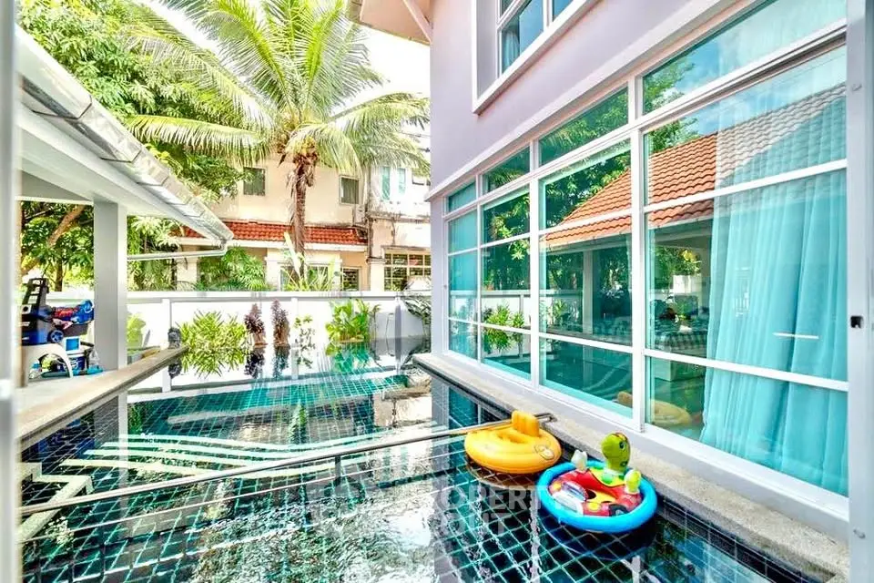 Luxurious home with private pool and lush greenery, perfect for relaxation and entertaining.