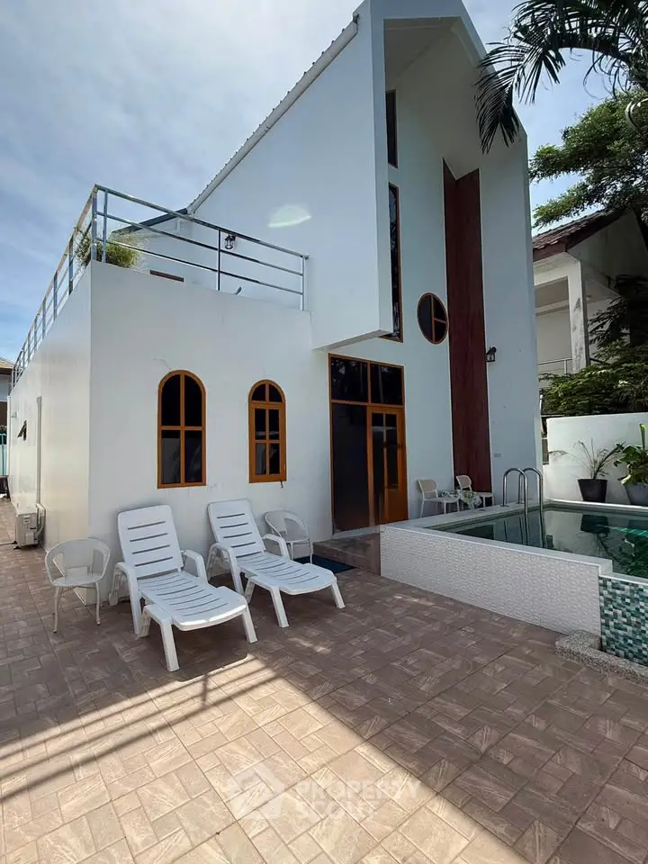 Modern villa with private pool and stylish architecture, featuring a spacious patio and elegant design.