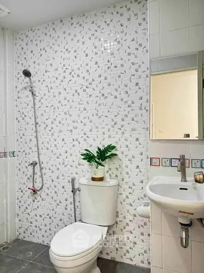 Modern bathroom with stylish mosaic tiles and sleek fixtures