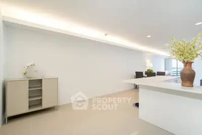 Spacious modern living area with elegant decor and ample natural light.