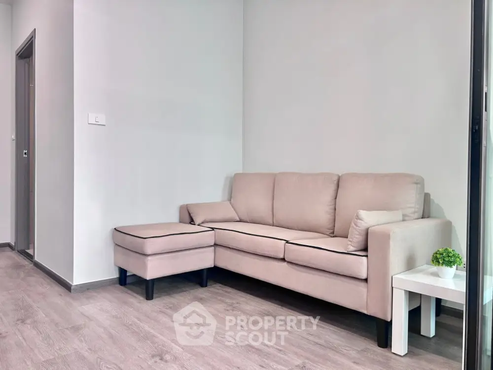 Modern living room with beige sofa and minimalist decor