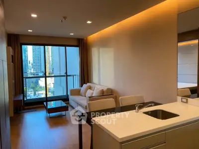 Modern living room with city view, featuring sleek furniture and open kitchen layout.