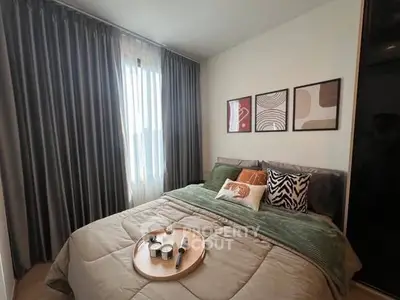 Cozy bedroom with stylish decor and natural light, perfect for relaxation and comfort.