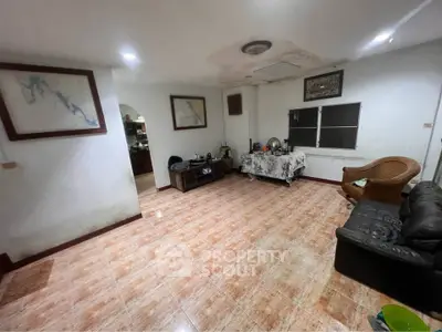 Spacious living room with tiled flooring and cozy seating area