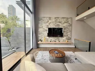 Modern living room with large windows and stylish decor in a luxury apartment