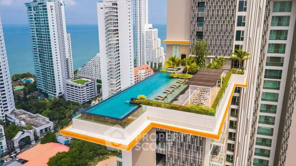 Luxurious high-rise building with stunning rooftop pool and ocean view.