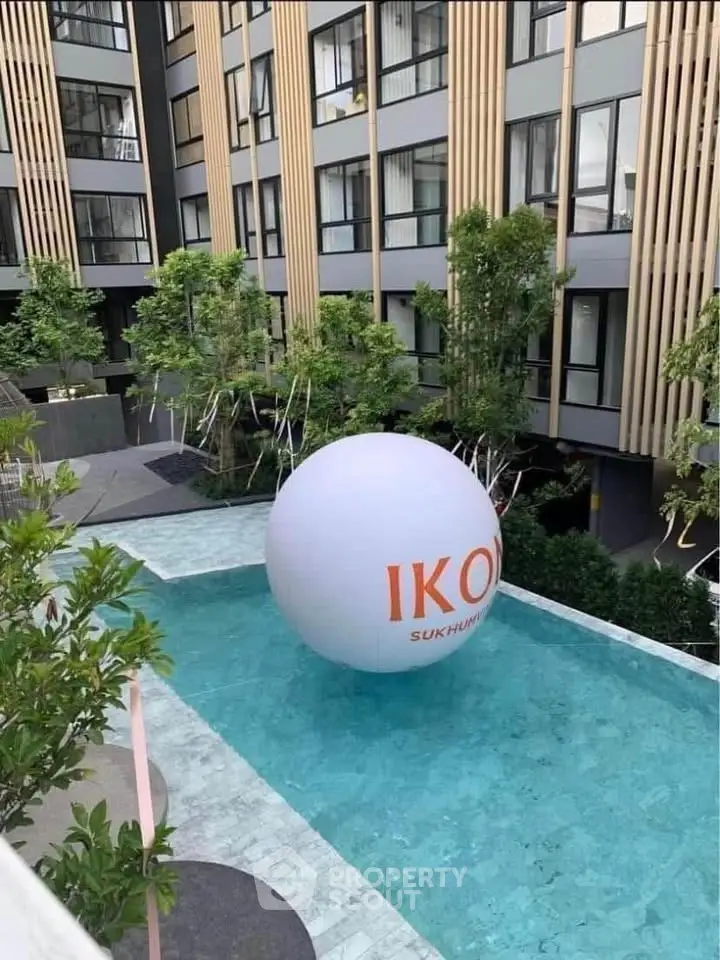 Modern apartment building with pool and unique architectural design