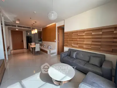 Modern living room with stylish decor and open dining area