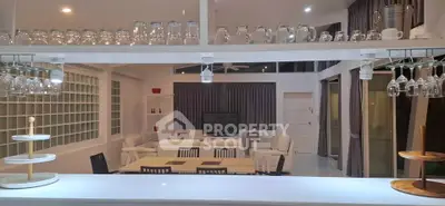 Spacious modern living room with open kitchen and elegant decor