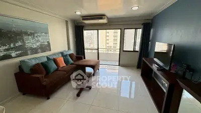 Spacious living room with modern decor and city view balcony