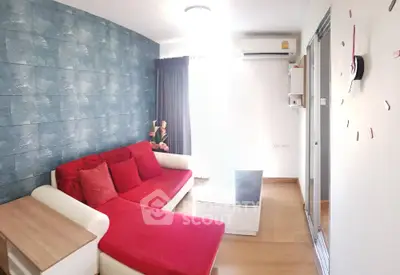 Modern living room with red sofa and stylish decor in a cozy apartment