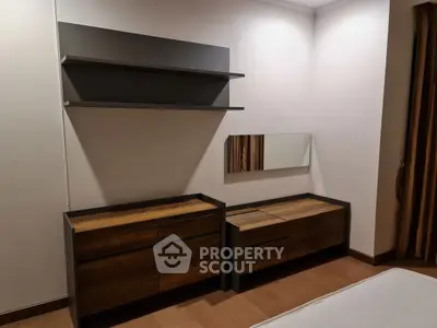 Modern bedroom with sleek wooden furniture and minimalist design