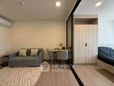 Modern studio apartment with cozy living area and stylish decor