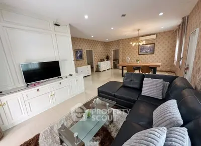 Spacious living room with elegant decor and modern furniture, perfect for family gatherings.