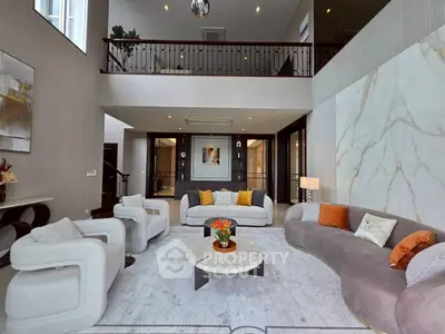 Luxurious modern living room with high ceilings and elegant decor