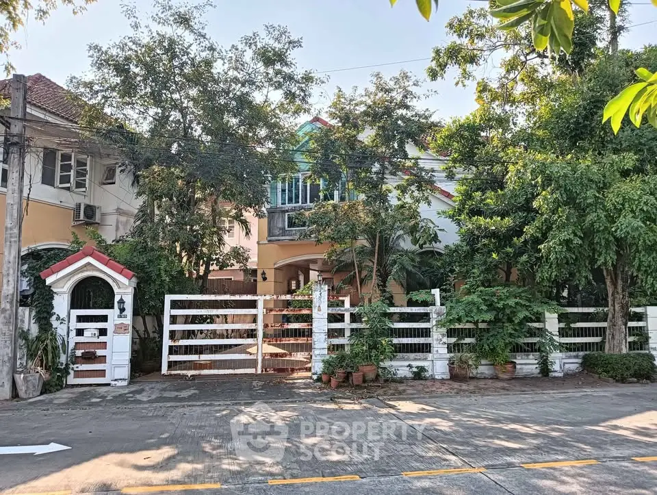 Charming suburban house with lush greenery and inviting entrance