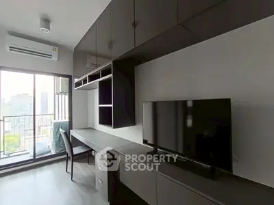Modern living room with sleek furniture and city view balcony