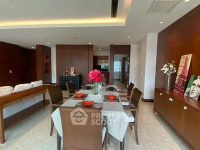 Elegant dining area with wooden furniture and modern decor in spacious living room