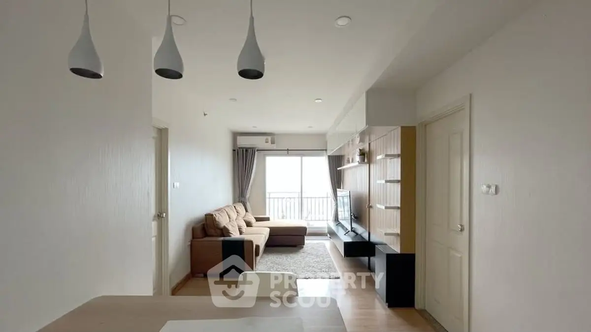 Modern living room with cozy sofa and stylish lighting in a bright apartment