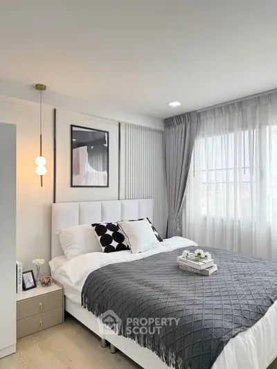 Modern bedroom with elegant decor and natural light