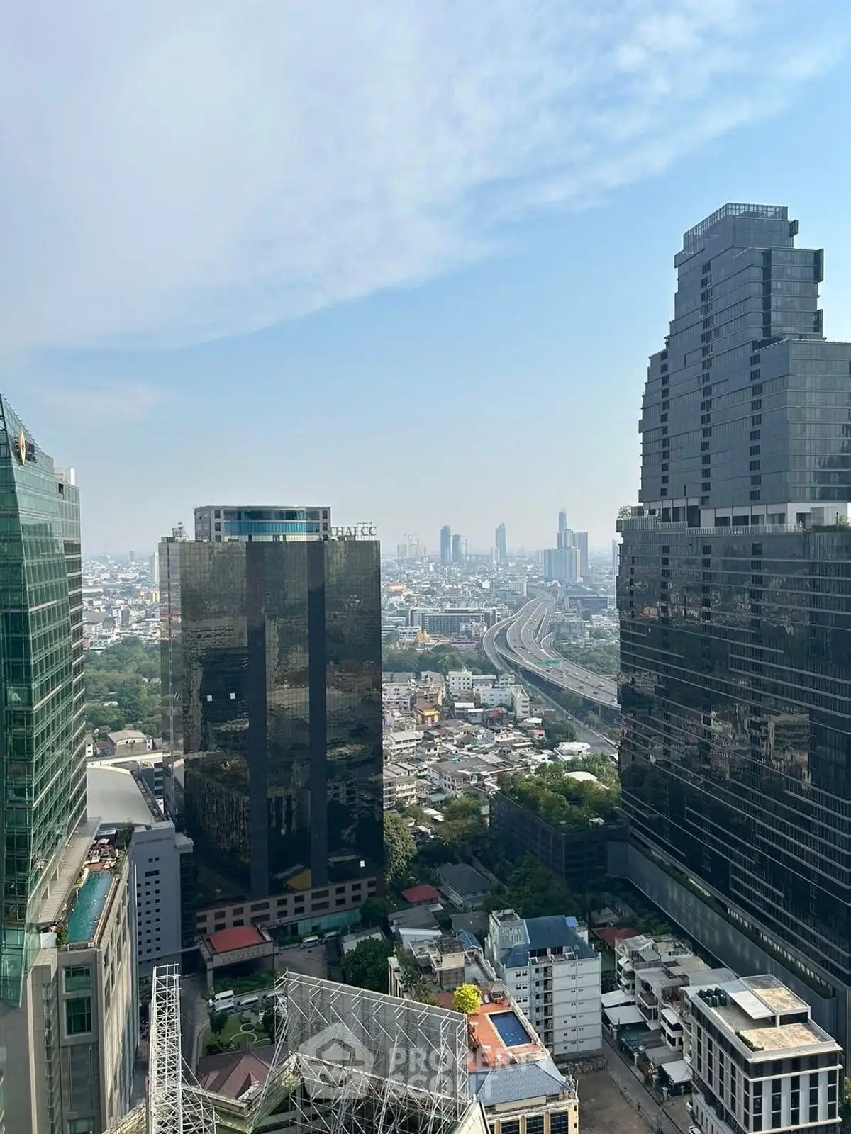 Stunning cityscape view from high-rise building showcasing urban skyline and modern architecture.