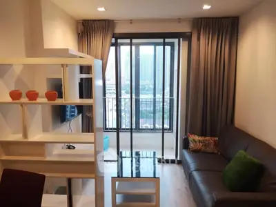 Modern living room with balcony view in urban apartment