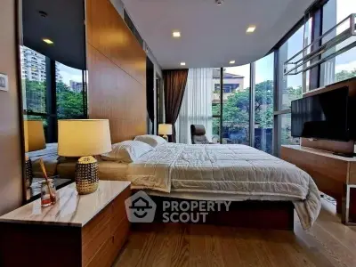 Luxurious bedroom with floor-to-ceiling windows and modern decor in urban apartment