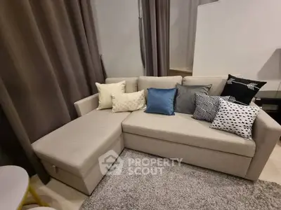 Modern living room with stylish sectional sofa and decorative pillows