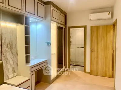 Modern bedroom with built-in wardrobe and air conditioning unit