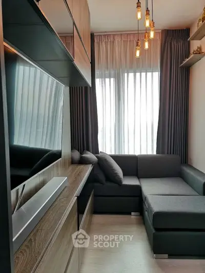 Modern living room with stylish lighting and cozy sectional sofa